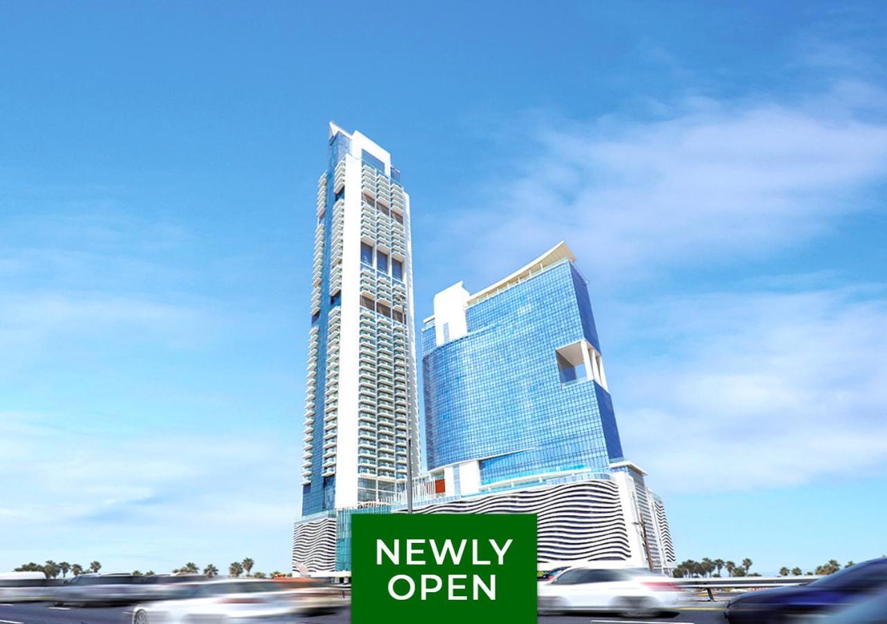 Movenpick Jumeirah Village Triangle Дубай Екстер'єр фото The 101 Tower