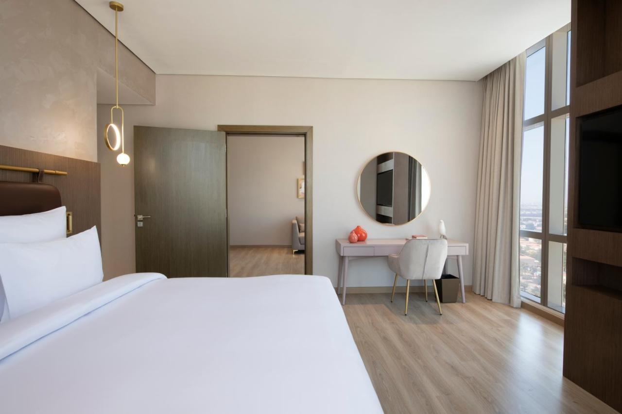 Movenpick Jumeirah Village Triangle Дубай Екстер'єр фото A bedroom at the hotel