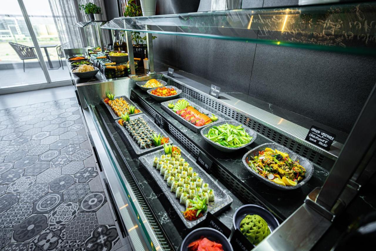 Movenpick Jumeirah Village Triangle Дубай Екстер'єр фото A salad bar