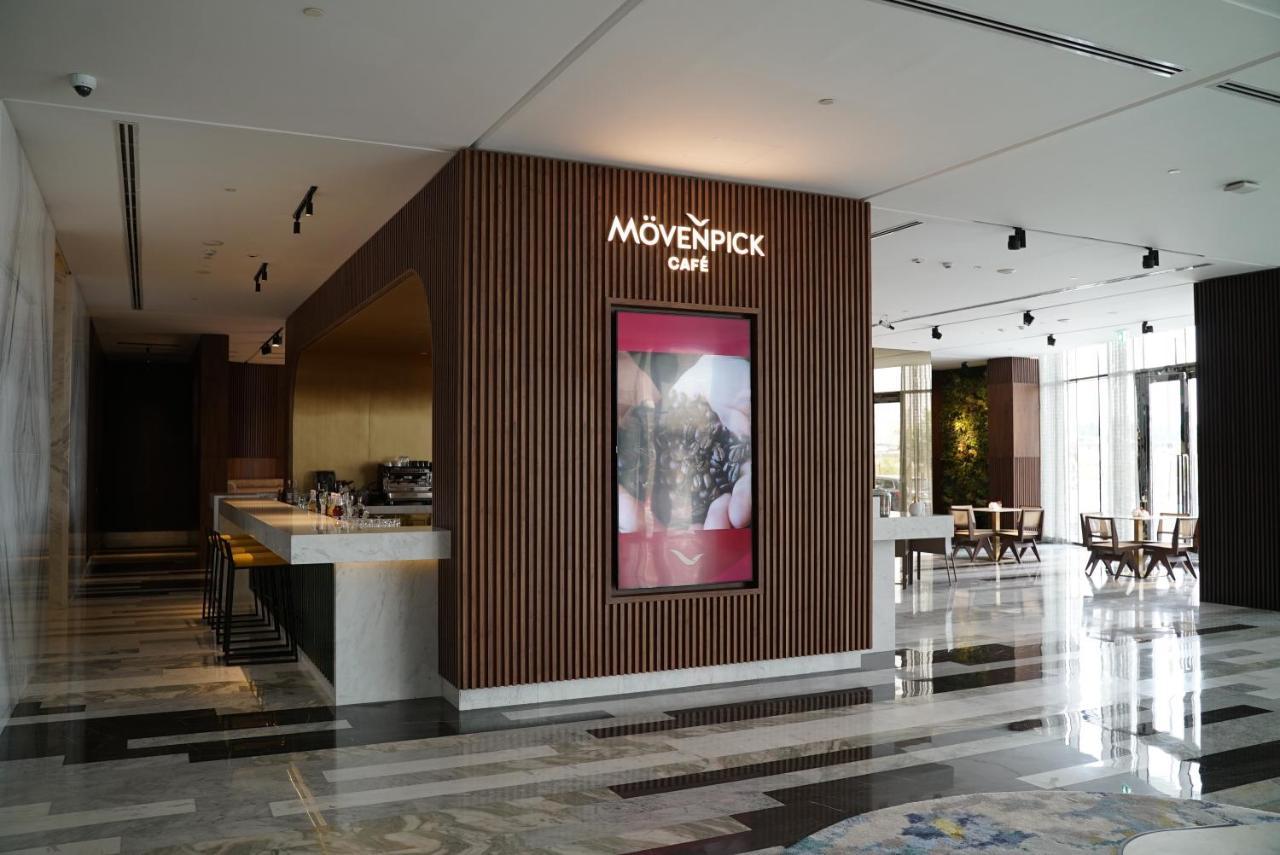 Movenpick Jumeirah Village Triangle Дубай Екстер'єр фото Mövenpick Café in the lobby of the Kempinski Hotel, Amman, Jordan