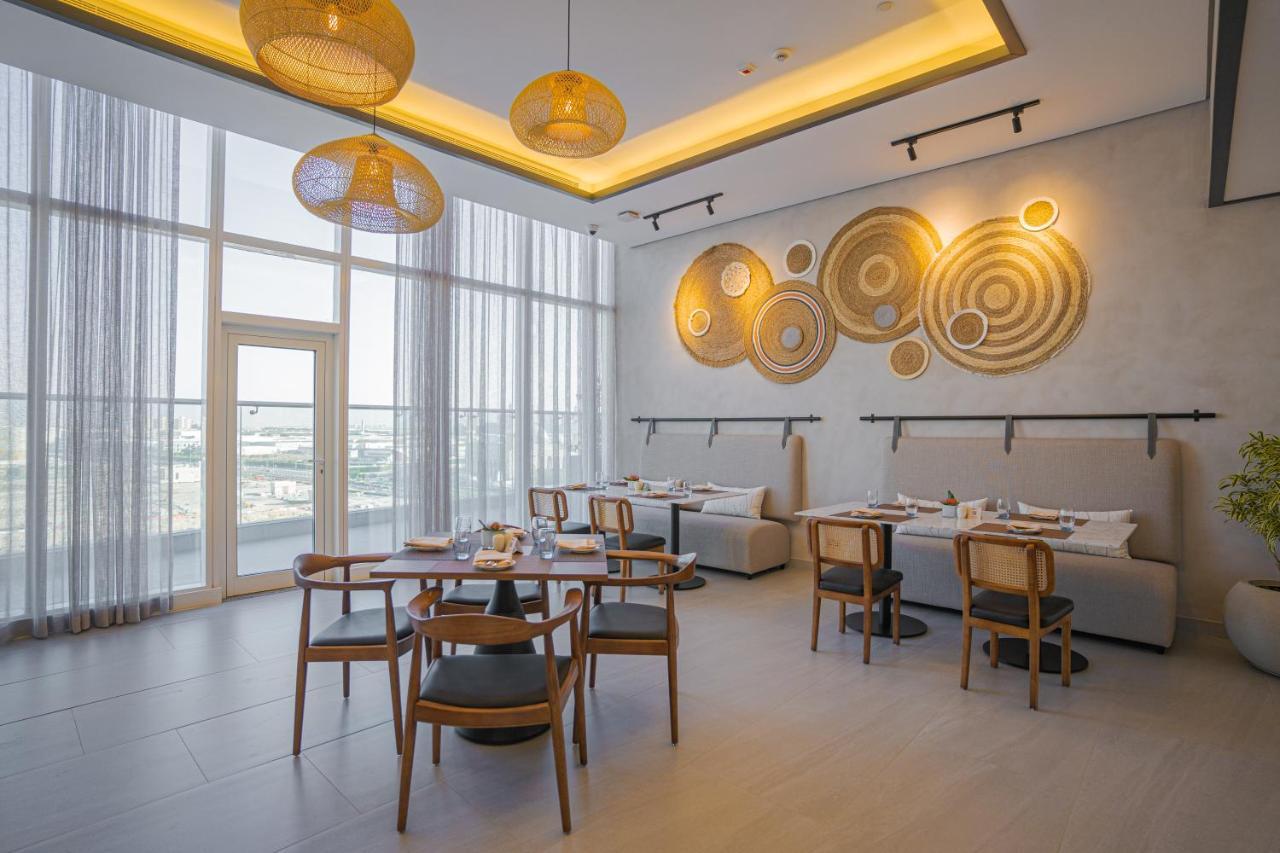 Movenpick Jumeirah Village Triangle Дубай Екстер'єр фото The restaurant