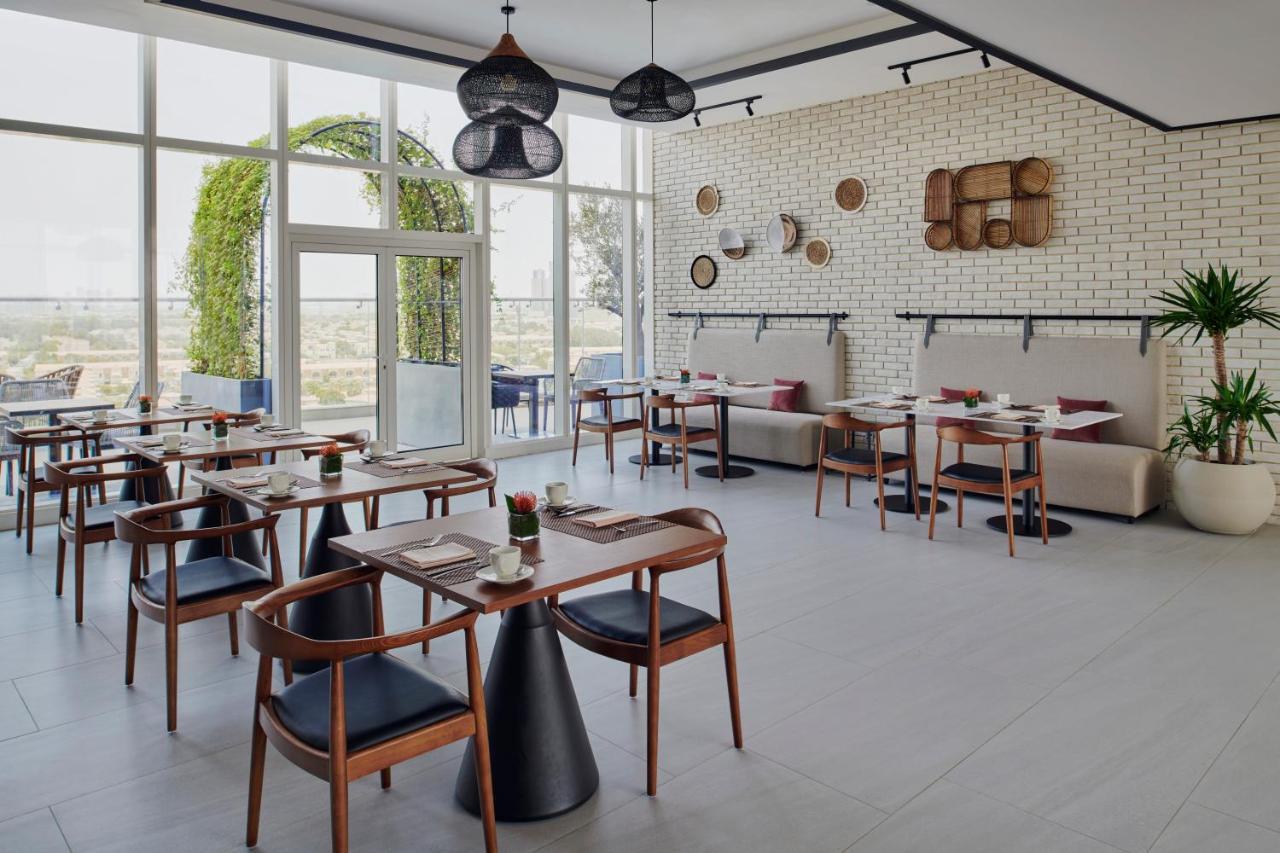 Movenpick Jumeirah Village Triangle Дубай Екстер'єр фото Restaurant