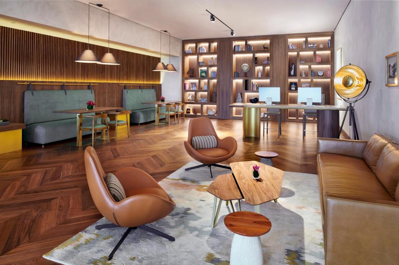 Movenpick Jumeirah Village Triangle Дубай Екстер'єр фото The Library at The Hari
