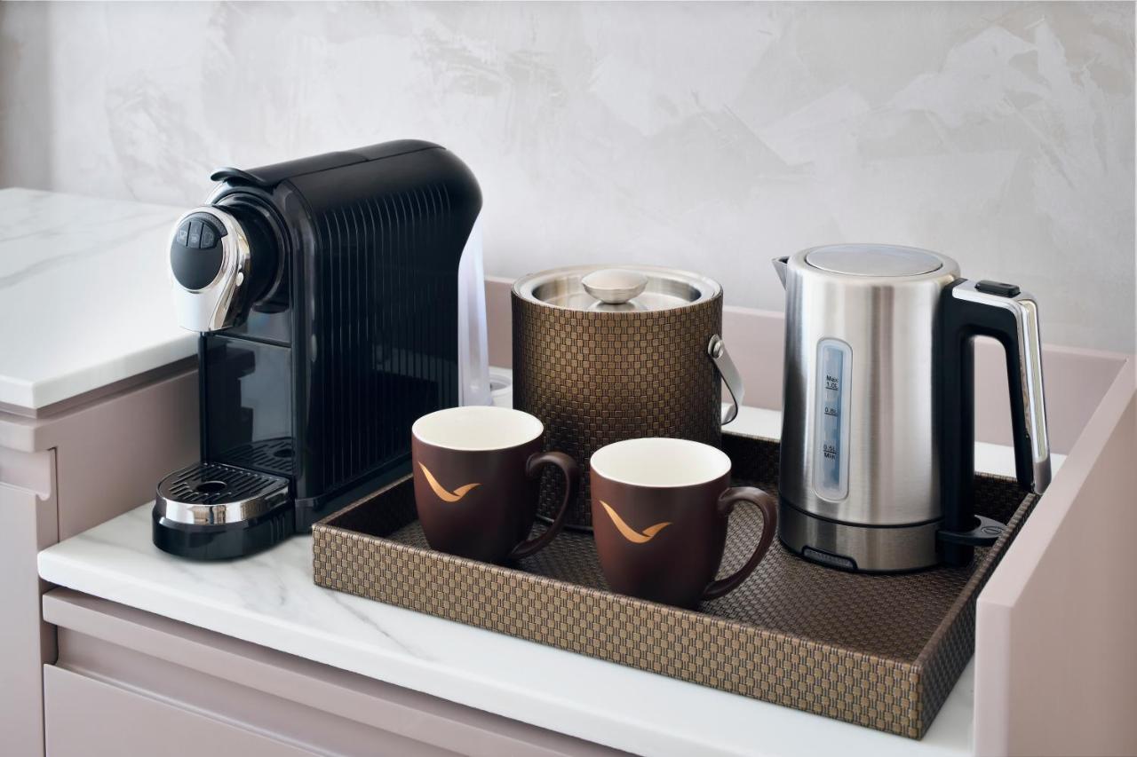 Movenpick Jumeirah Village Triangle Дубай Екстер'єр фото A Nespresso coffee machine
